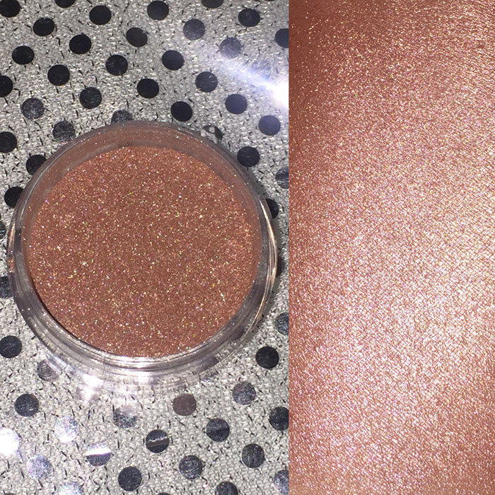 Aphrodite Loose Diamond Highlighter in a sleek container, showcasing its shimmering copper gold powder, perfect for highlighting and adding glow.